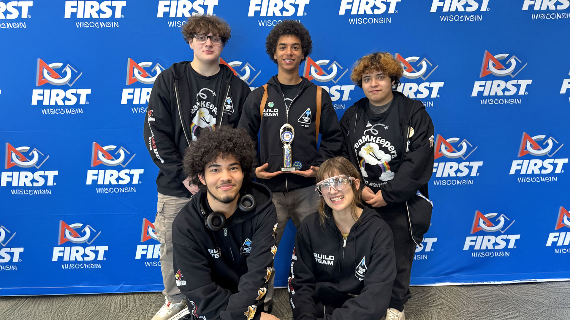 Students holding an award