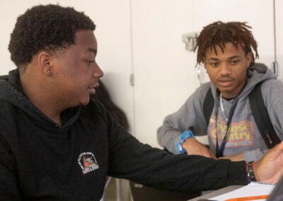 Two students in a classroom.