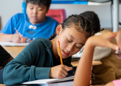 Children in a classroom working on an assignment.