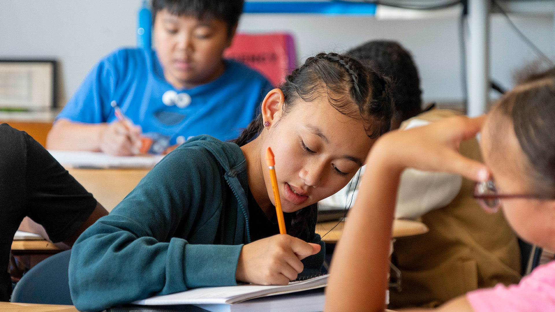 Children in a classroom working on an assignment.