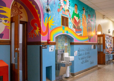 A colorful mural in the hallway of a school.