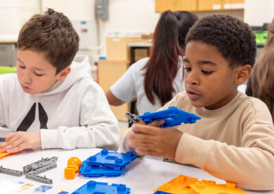 Children putting together building sets.