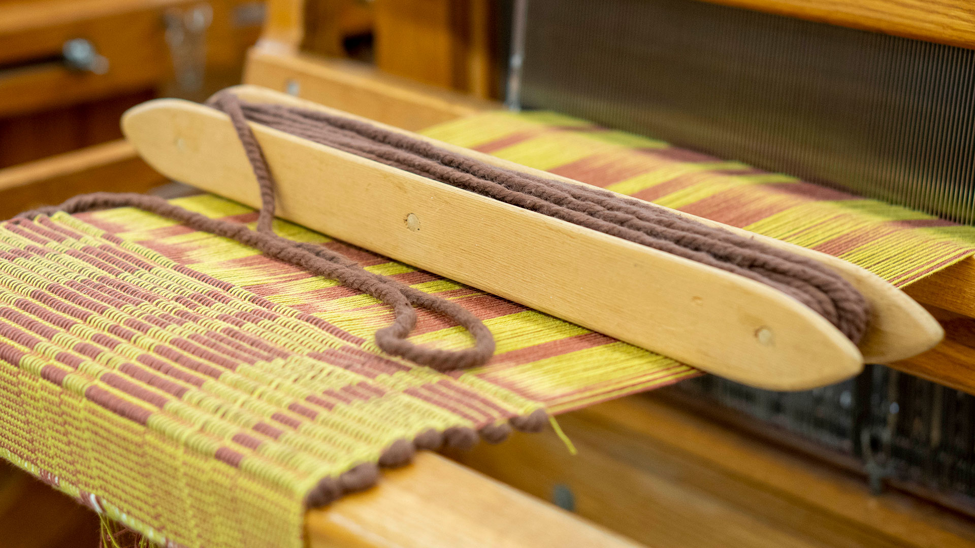 Close-up of a woven project on a loom.