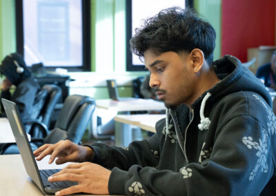 A student using a computer.