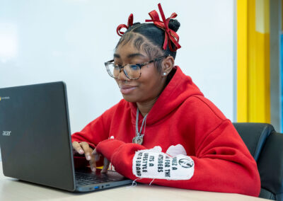 A girl using a computer.