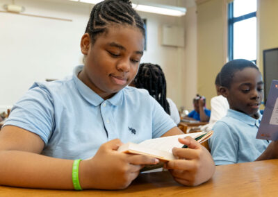 Students in a classroom reading.