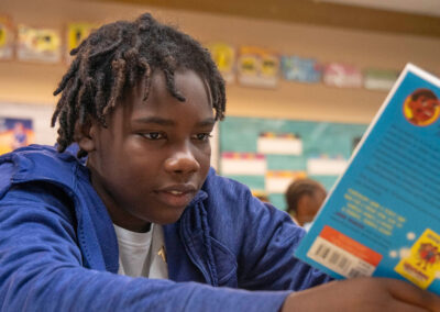 A boy reads a book.