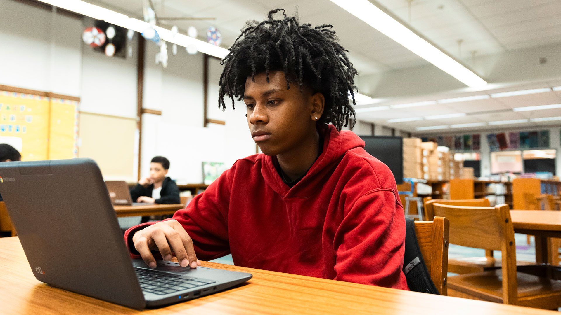 A student using a laptop.