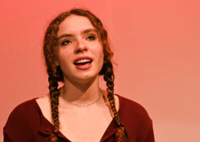 Close-up of a girl singing.