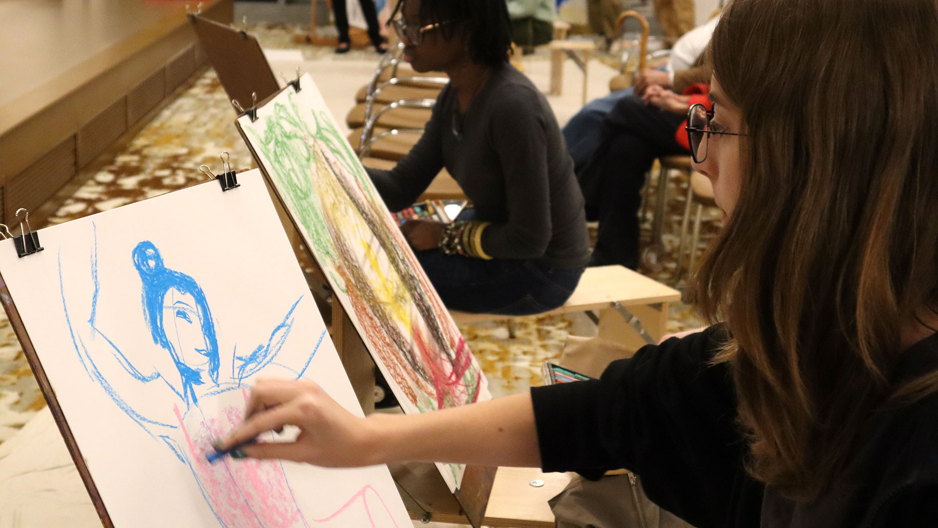 An artist at an easel.