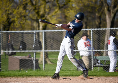 A baseball player batting.