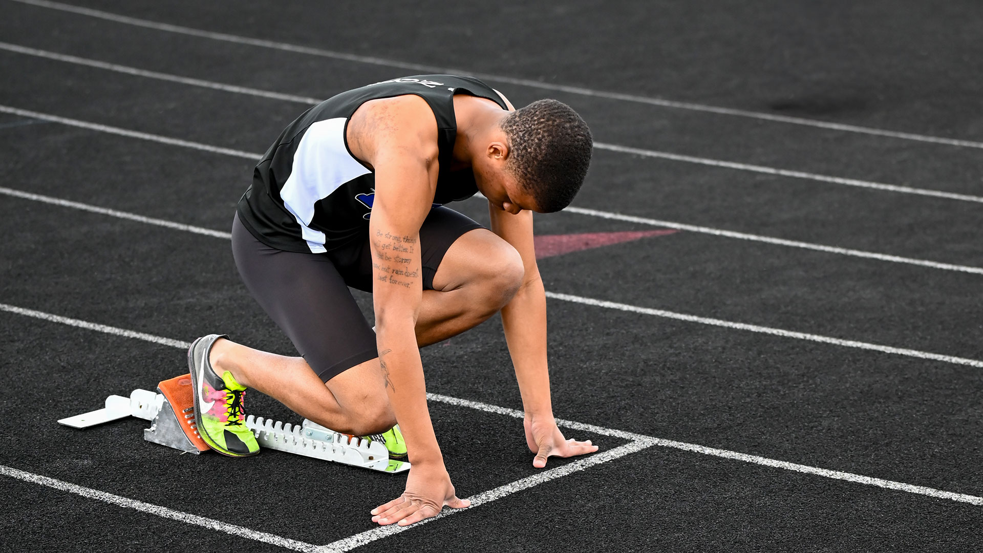 A track student at the starting block.