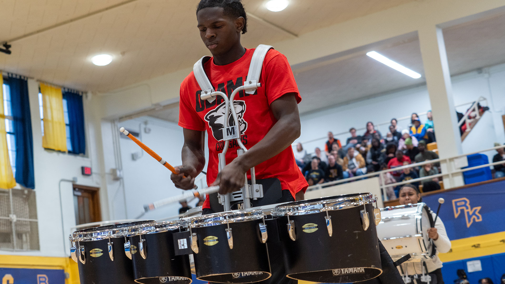A boy drumming.