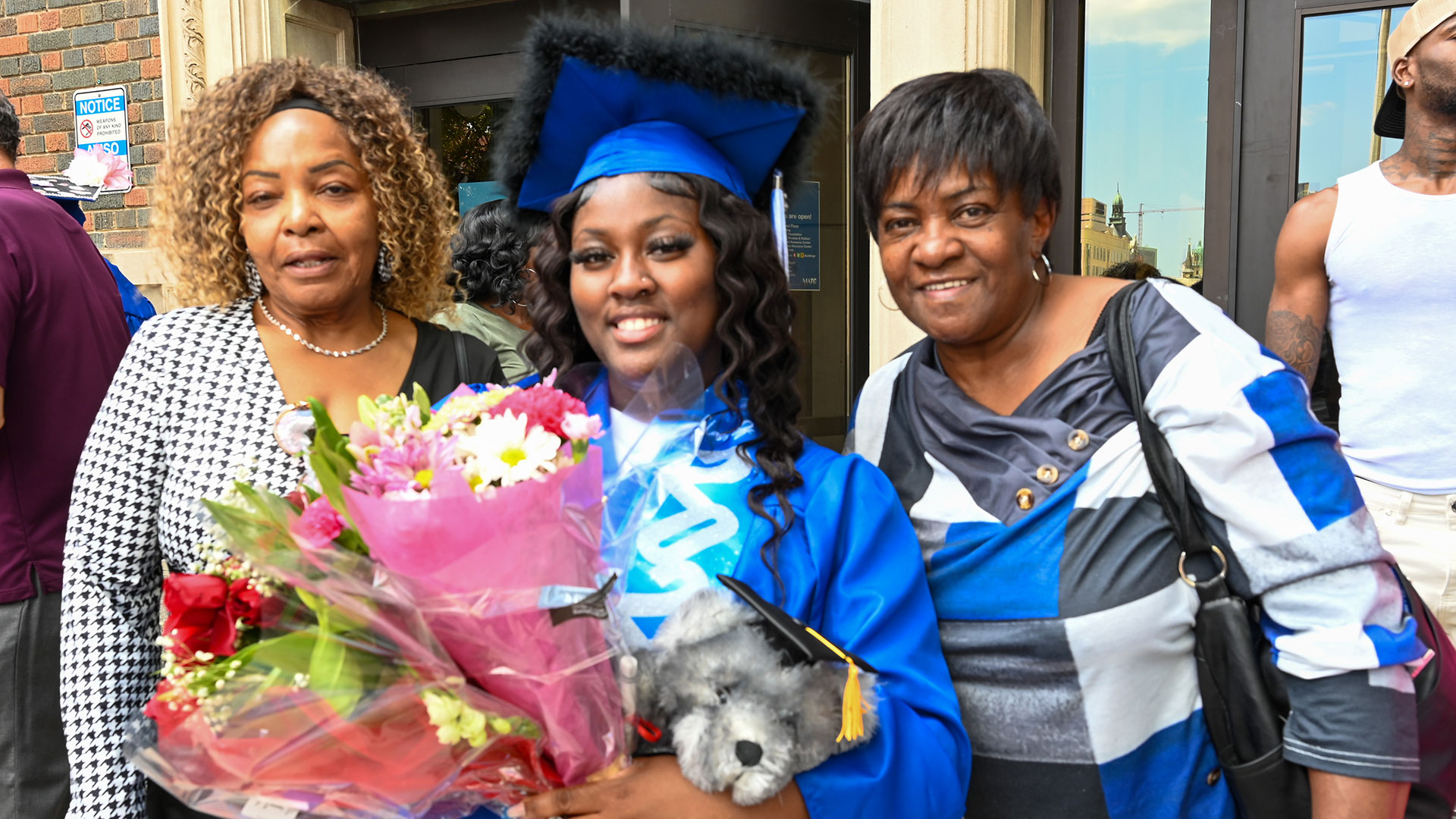 Graduates with their families outside after the ceremony.