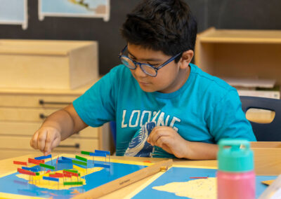 A student places flags on a map.