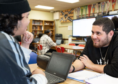 People chatting in a classroom.