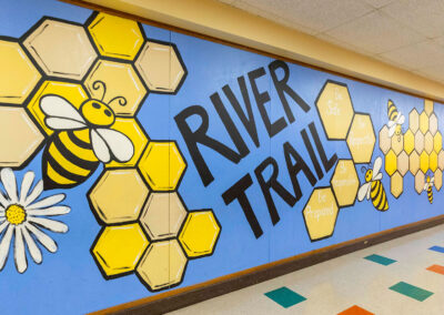 A mural in a hallway with a beehive.