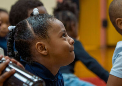 A young girl looking up.