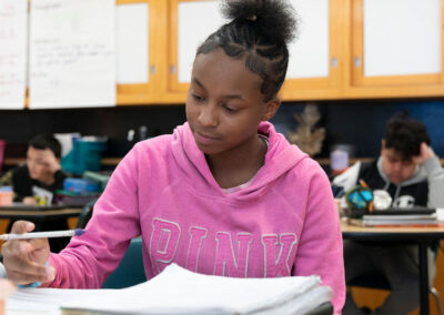 Students in a classroom working on an assignment.