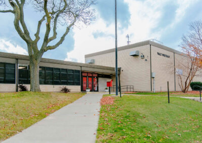The front of Walt Whitman School on a fall day.